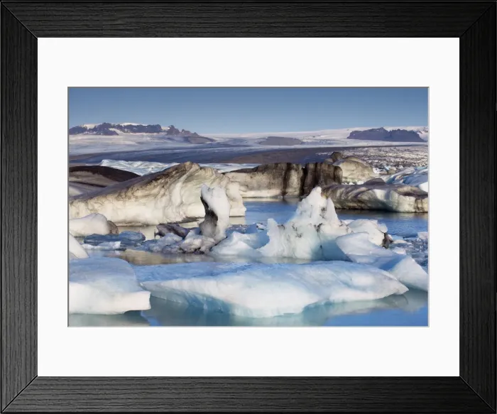 Framed Print : Icebergs in Jokulsarlon glacial lagoon, Breidamerkurjokull (Vatnajokull) glacier in the distance Framed Print : Icebergs in Jokulsarlon glacial lagoon, Breidamerkurjokull (Vatnajokull) glacier in the distance