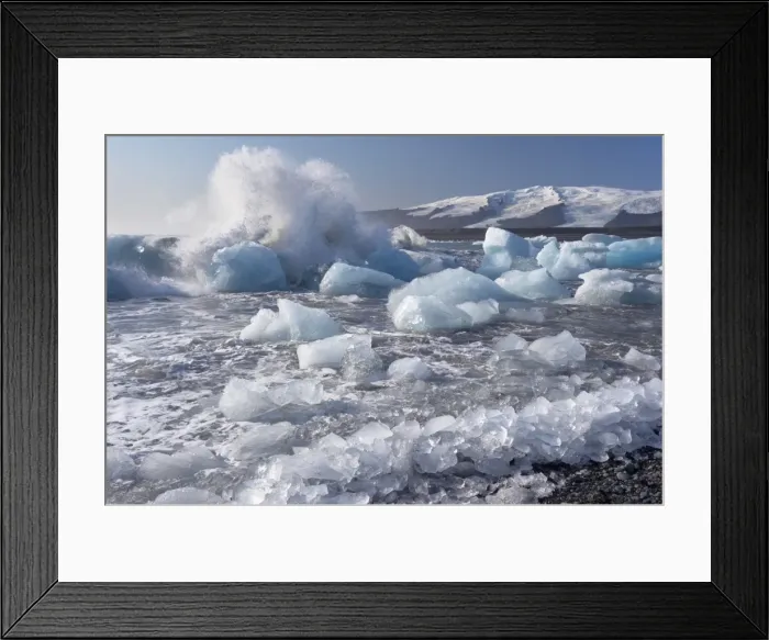 Framed Print : Wave splashing against broken icebergs, Breidamerkursandur black sands Framed Print : Wave splashing against broken icebergs, Breidamerkursandur black sands