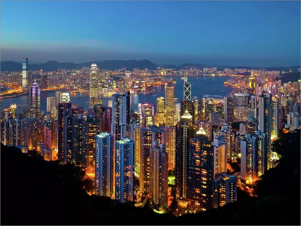 View over Hong Kong from Victoria Peak, the illuminated skyline of Central sits below The Peak