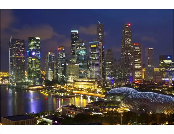Skyline of Financial district illuminated at dusk, Singapore, Southeast Asia, Asia