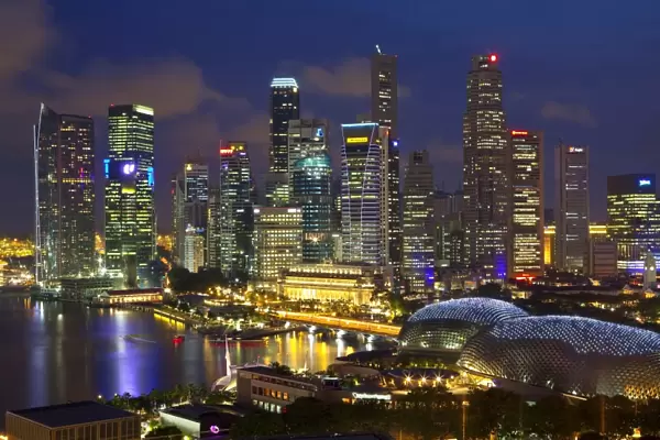 Skyline of Financial district illuminated at dusk, Singapore, Southeast Asia, Asia