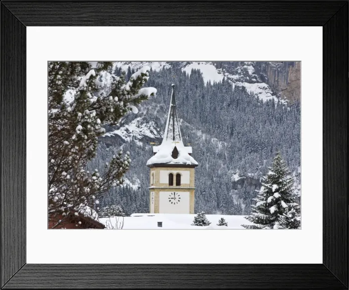 Framed Print : Grindelwald village church after a heavy fall of snow, Jungfrau region Framed Print : Grindelwald village church after a heavy fall of snow, Jungfrau region