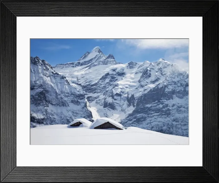 Framed Print : Partially buried buildings on the ski slopes in front of the Schreckhorn mountain Framed Print : Partially buried buildings on the ski slopes in front of the Schreckhorn mountain