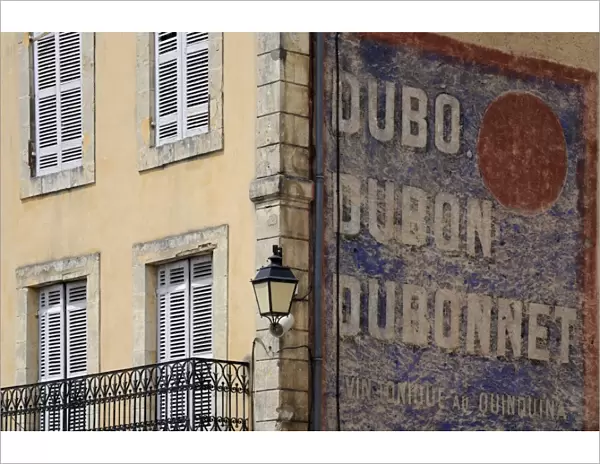 Painted Dubonnet advert on the wall of a building, Belves, Aquitaine, Dordogne