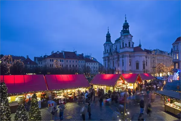 Old Town Square at Christmas time and St. Nicholas church, Prague, Czech Republic, Europe