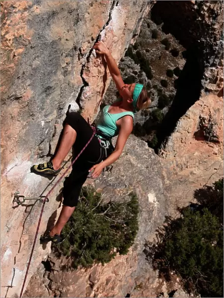 A climber on a route along the arch of El Delphin (The Dolphin) in the Mascun Gorge