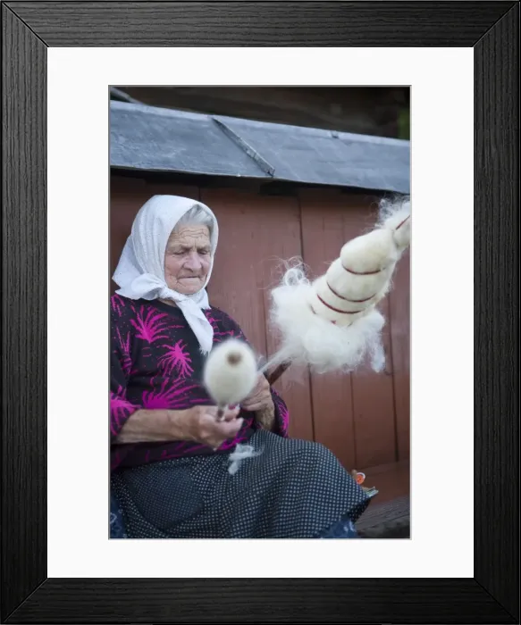 Framed Print : Elderly woman spinning wool, Budesti, Maramures, Romania, Europe