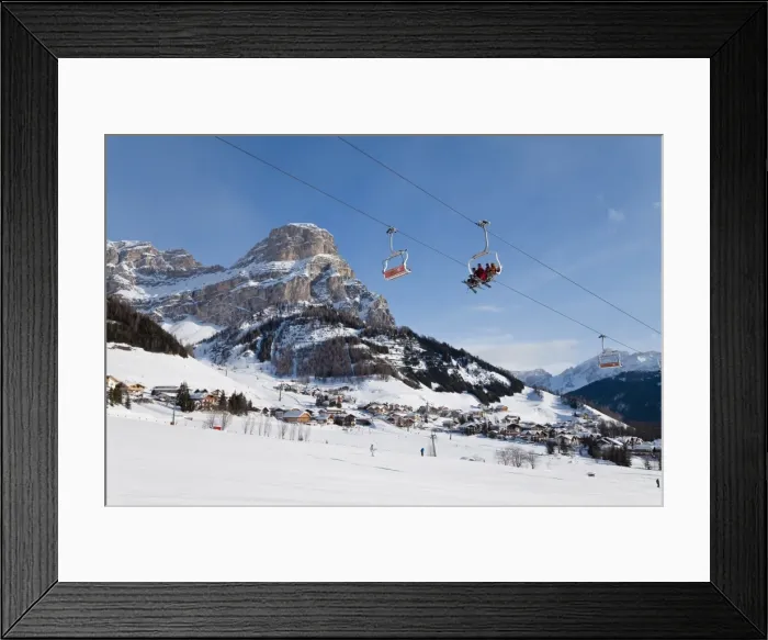 Framed Print : The village of Colfosco in Badia, 1645m, and Sella Massif range of mountains under winter snow Framed Print : The village of Colfosco in Badia, 1645m, and Sella Massif range of mountains under winter snow