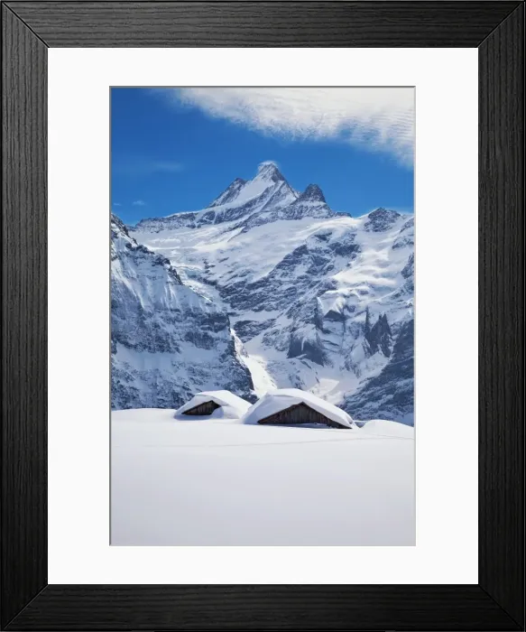 Framed Print : Partially buried buildings on the ski slopes in front of the Schreckhorn mountain Framed Print : Partially buried buildings on the ski slopes in front of the Schreckhorn mountain