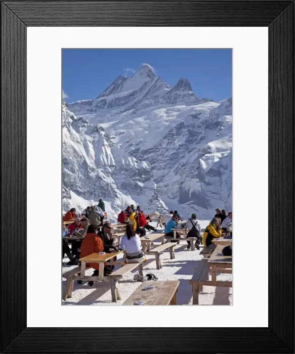 Framed Print : Relaxing outside a mountain restaurant in front of the peaks of the Schreckhorn mountain Framed Print : Relaxing outside a mountain restaurant in front of the peaks of the Schreckhorn mountain