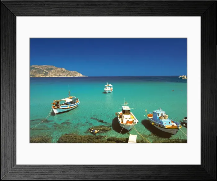Framed Print : Fishiing boats and man snorkelling at Anopi Beach, Karpathos, Dodecanese