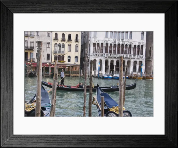Framed Print : Gondola passing moorings at Riva del Vin on the Grand Canal, Rialto, Venice Framed Print : Gondola passing moorings at Riva del Vin on the Grand Canal, Rialto, Venice