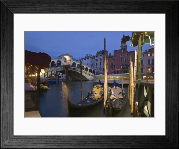 Framed Print : Gondolas moored on the Grand Canal at Riva del Vin, with Rialto bridge behind Framed Print : Gondolas moored on the Grand Canal at Riva del Vin, with Rialto bridge behind