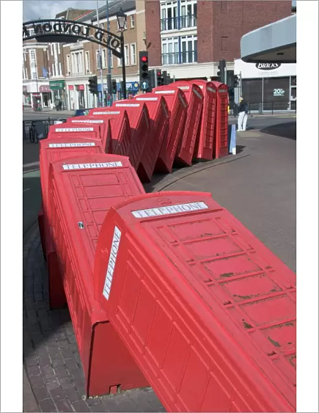 Red telephone box sculpture Out of Order by David Mach. Kingston Upon Thames