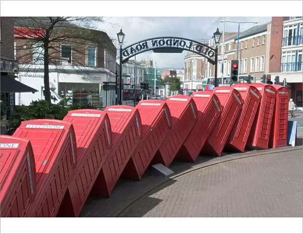 Red telephone box sculpture Out of Order by David Mach. Kingston Upon Thames