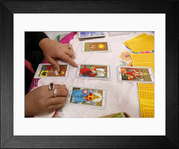 Framed Print : Fortuneteller laying cards on the table during a divination, Paris, France, Europe Framed Print : Fortuneteller laying cards on the table during a divination, Paris, France, Europe