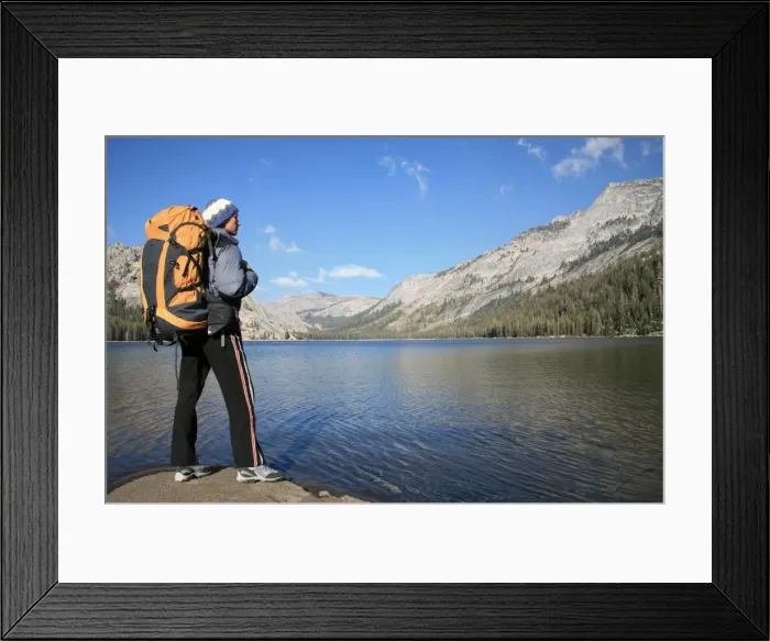 Framed Print : A hiker takes in the view on the shore of Tenaya Lake, in the Tuolumne Meadows Framed Print : A hiker takes in the view on the shore of Tenaya Lake, in the Tuolumne Meadows