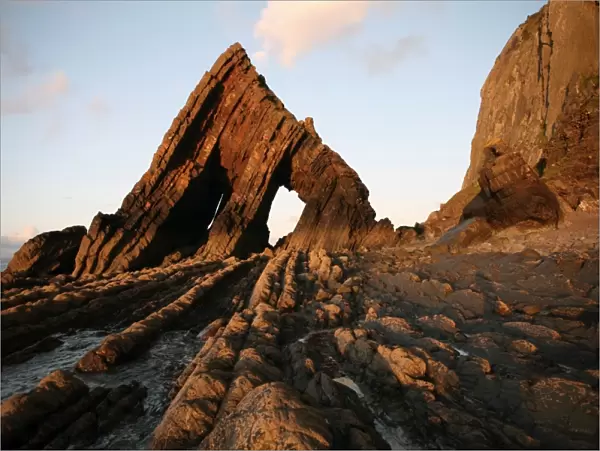 The light of the setting sun illuminates the unusual architecture of Blackchurch Rock