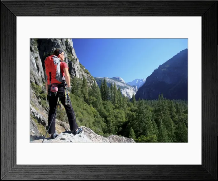 Framed Print : A climber takes a break on the lower slopes of El Capitan to enjoy the view up the Yosemite Valley towards Washington Column and North Dome, Yosemite National Park, UNESCO World Heritage Site, California, United States of America