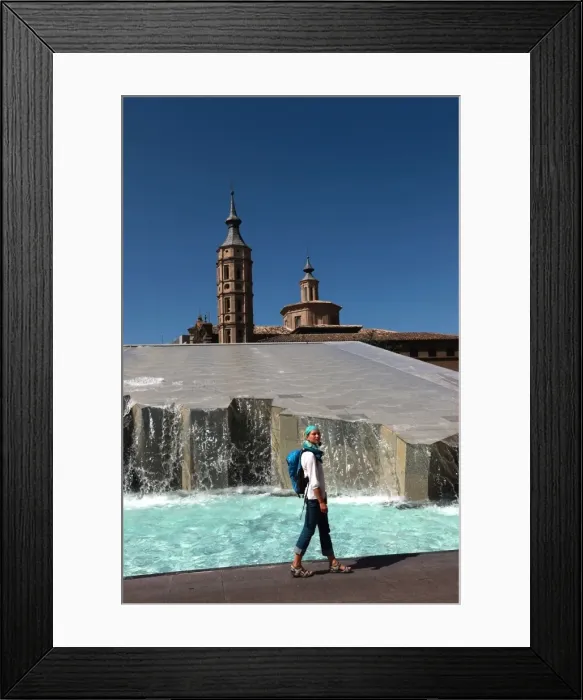 Framed Print : Woman beside water features of Plaza del Pilar, overlooking the Basilica de Nuestra Senora del Pilar, Zaragoza