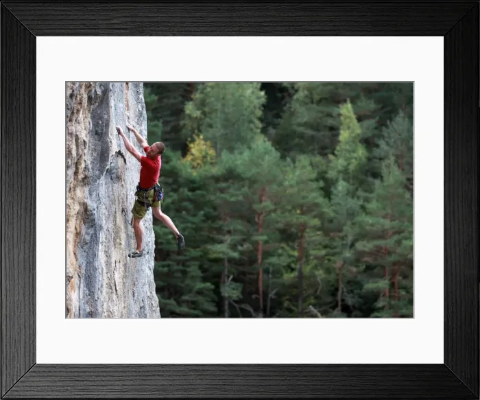 Framed Print : A climber tackles a steep route on limestone cliffs near the mountain town of Bielsa Framed Print : A climber tackles a steep route on limestone cliffs near the mountain town of Bielsa