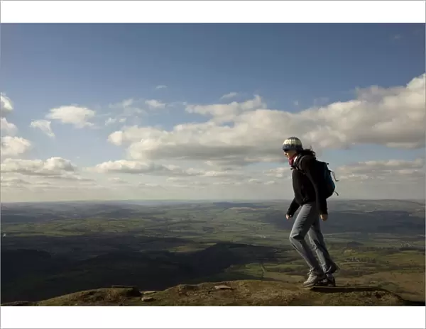 A hiker walks north from Hay Bluff, above Hay-on-Wye, Brecon Beacons National Park
