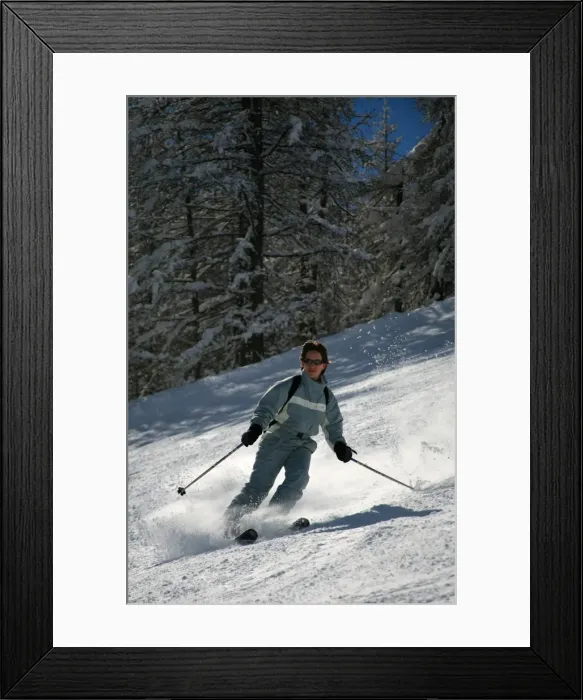 Framed Print : A skier enjoys spring snow on the piste in the small resort of Pelvoux Framed Print : A skier enjoys spring snow on the piste in the small resort of Pelvoux