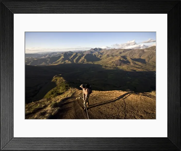 Framed Print : A climber descending a long granite ridge from the upper Tsaranoro Massif Framed Print : A climber descending a long granite ridge from the upper Tsaranoro Massif