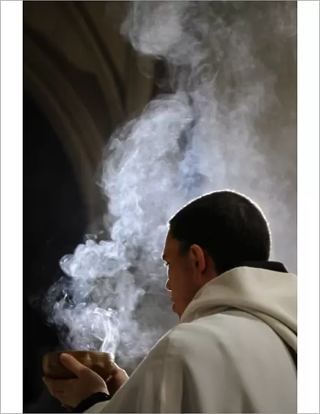 Monk holding an incense bowl during an Ecumenical celebration, Paris, France, Europe