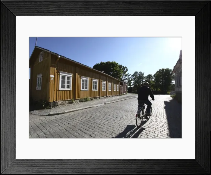 Framed Print : Cyclist on cobblestone street, Old Town, Rauma, Satakunta, Finland, Scandinavia, Europe Framed Print : Cyclist on cobblestone street, Old Town, Rauma, Satakunta, Finland, Scandinavia, Europe