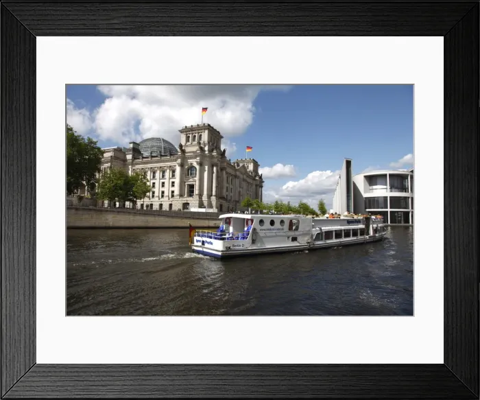 Framed Print : Tour boat on river cruise on the Spree River passing the Reichstag (Parliament) Framed Print : Tour boat on river cruise on the Spree River passing the Reichstag (Parliament)