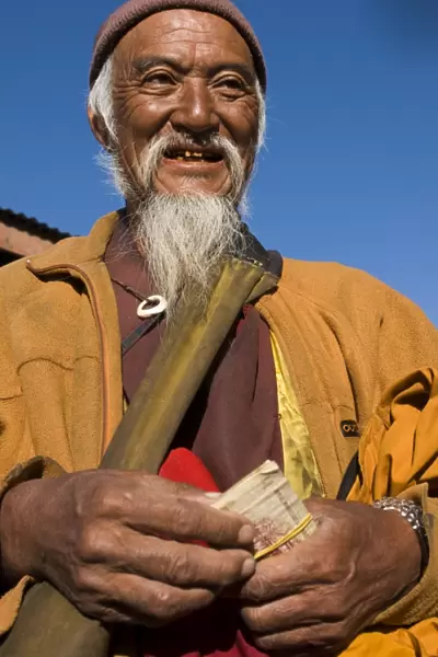 Portrait of a monk doing his morning shopping, Paro, Bhutan, Asia