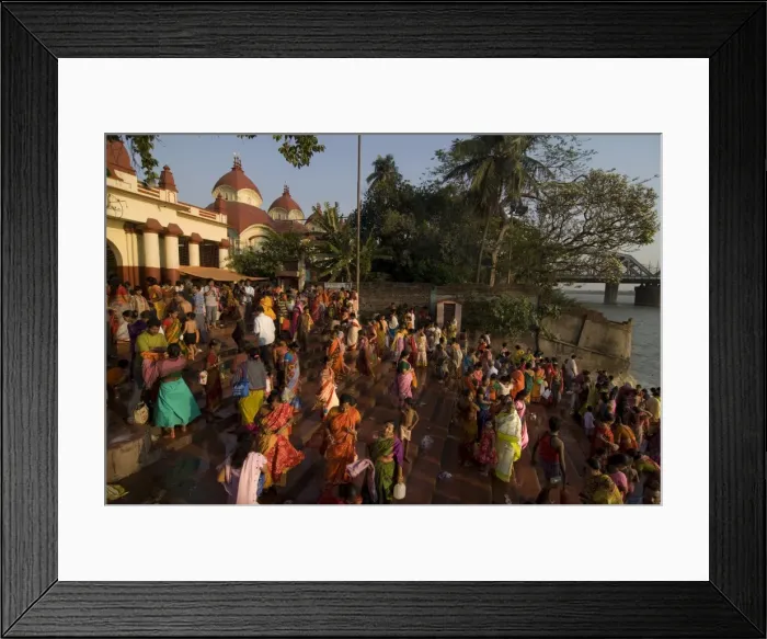 Framed Print : Pilgrims taking a ritual bath at a Kali temple on the river banks of the Hoogly river Framed Print : Pilgrims taking a ritual bath at a Kali temple on the river banks of the Hoogly river