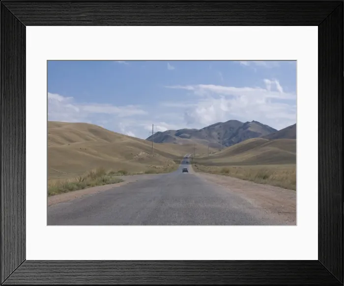 Framed Print : Road leading into the Tian Shan mountains, Kyrgyzstan, Central Asia Framed Print : Road leading into the Tian Shan mountains, Kyrgyzstan, Central Asia