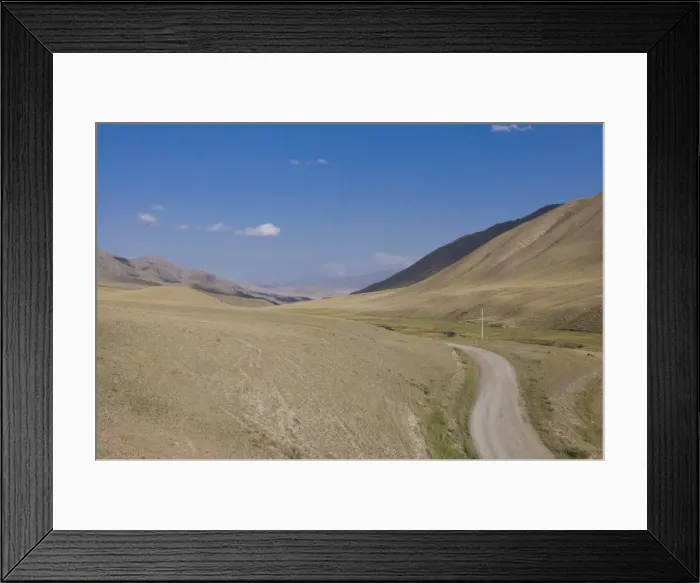 Framed Print : Country road leading into wilderness, near Song Kol, Kyrgyzstan, Central Asia Framed Print : Country road leading into wilderness, near Song Kol, Kyrgyzstan, Central Asia