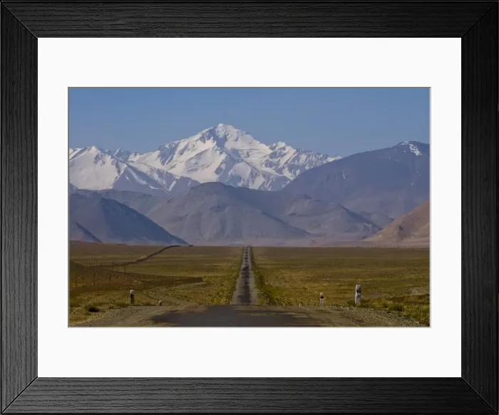 Framed Print : Country road leading to snow covered mountains, Karakul, Tajikistan, Central Asia Framed Print : Country road leading to snow covered mountains, Karakul, Tajikistan, Central Asia