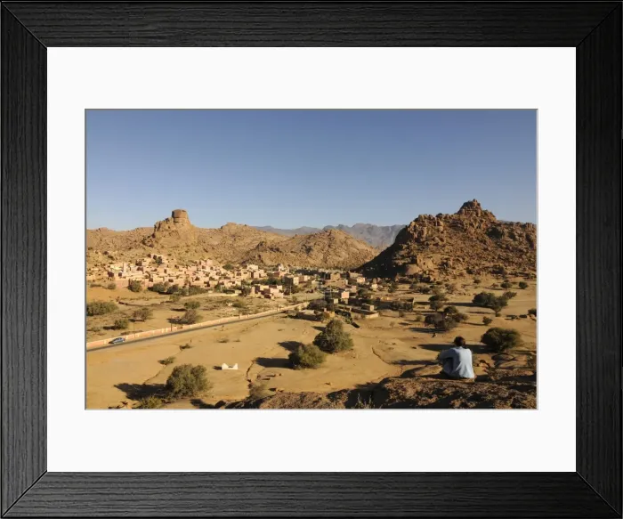 Framed Print : Tourist relaxing in the magical landscape of Tafraoute, Southern Morocco Framed Print : Tourist relaxing in the magical landscape of Tafraoute, Southern Morocco