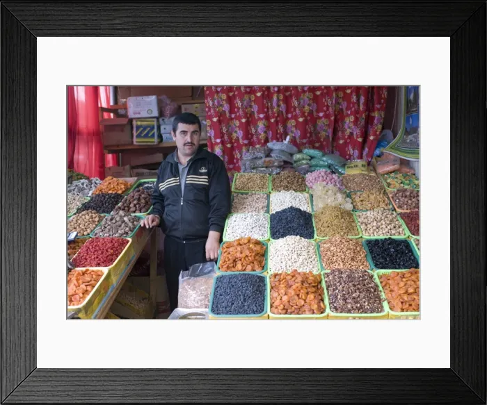 Framed Print : Shopseller in the bazaar selling dried fruits, Almaty, Kazakhstan, Central Asia, Asia