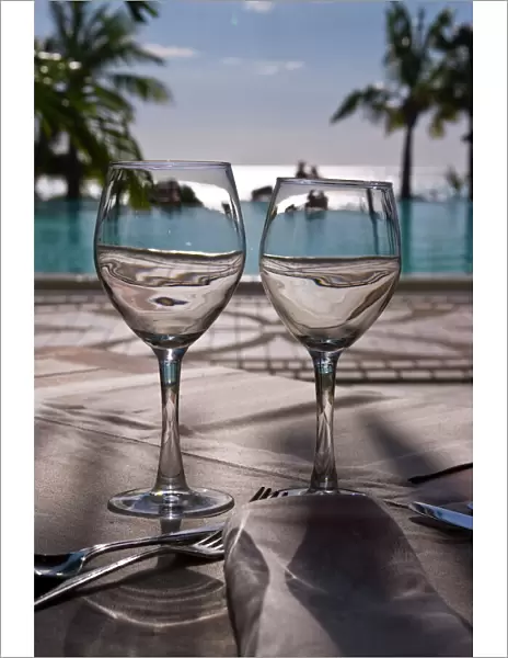 Wine glasses in front of the pool of the Beachcomber Le Paradis, Mauritius