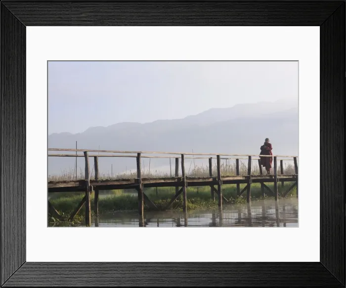 Framed Print : Buddhist monk, walking in the early morning on a wooden walkway, Inle Lake Framed Print : Buddhist monk, walking in the early morning on a wooden walkway, Inle Lake