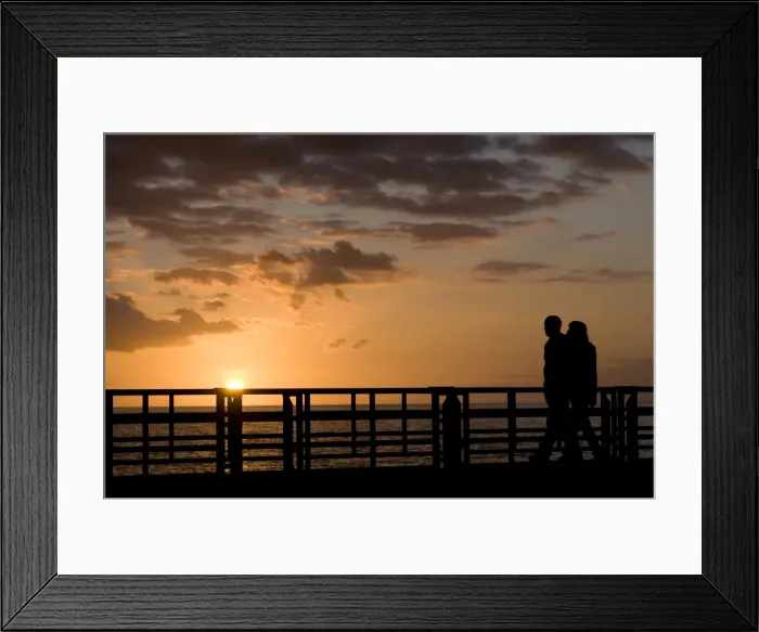 Framed Print : Couple walking along the pier of Playa de las Americas, Tenerife, Canary Islands Framed Print : Couple walking along the pier of Playa de las Americas, Tenerife, Canary Islands