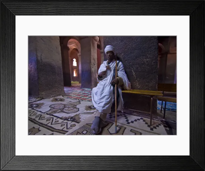 Framed Print : Monk sitting in the rock carved monastery of Lalibela, Northern Ethiopia, Africa Framed Print : Monk sitting in the rock carved monastery of Lalibela, Northern Ethiopia, Africa