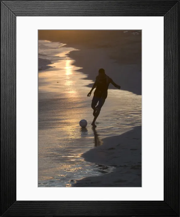 Framed Print : Young man playing football at sandbeach in twilight, Santa Maria, Sal, Cape Verde, Africa Framed Print : Young man playing football at sandbeach in twilight, Santa Maria, Sal, Cape Verde, Africa