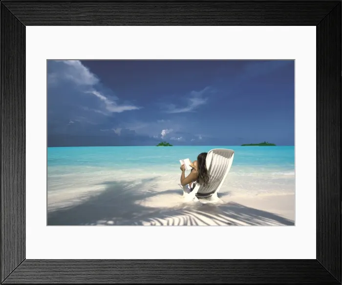 Framed Print : Woman reading a book on the beach, Maldives, Indian Ocean, Asia Framed Print : Woman reading a book on the beach, Maldives, Indian Ocean, Asia