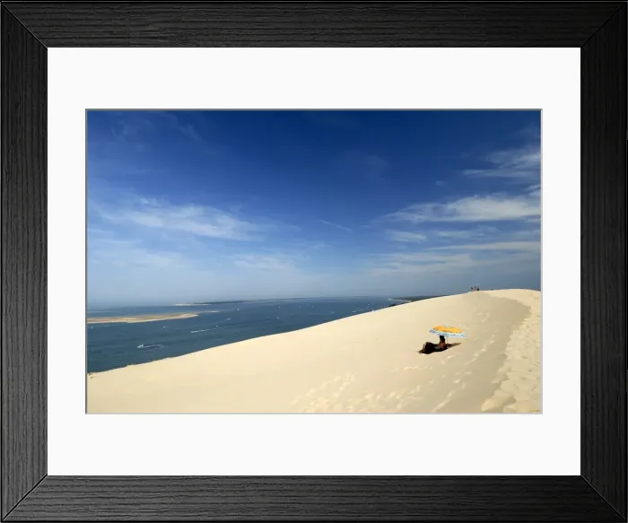 Framed Print : Tourists under a parasol on the Dune du Pyla, largest dune in Europe, Bay of Arcachon Framed Print : Tourists under a parasol on the Dune du Pyla, largest dune in Europe, Bay of Arcachon