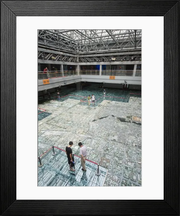 Framed Print : Visitors looking at a scale model of city buildings at the Beijing Planning Framed Print : Visitors looking at a scale model of city buildings at the Beijing Planning