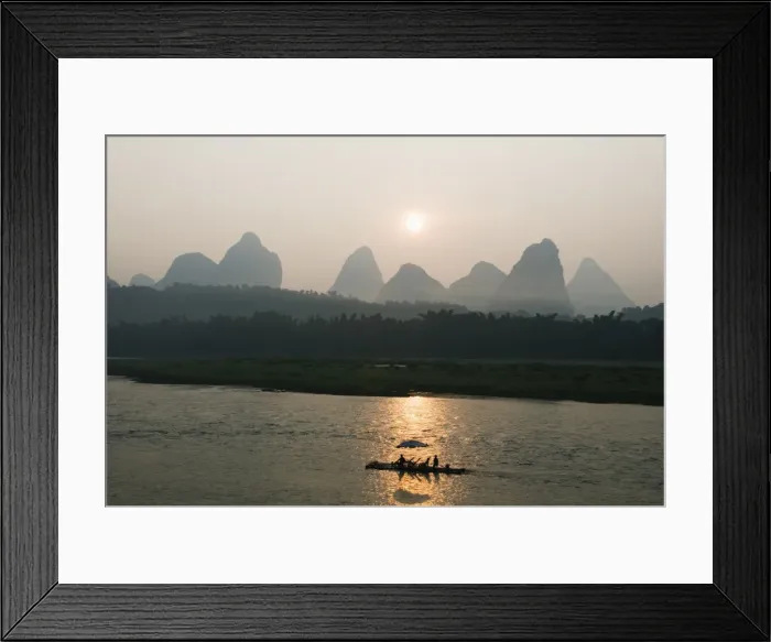 Framed Print : Tourist boat sailing through karst scenery at sunrise on the Li river Framed Print : Tourist boat sailing through karst scenery at sunrise on the Li river
