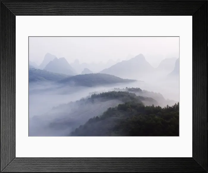 Framed Print : Early morning mist clinging to karst limestone scenery around Yangshuo Framed Print : Early morning mist clinging to karst limestone scenery around Yangshuo