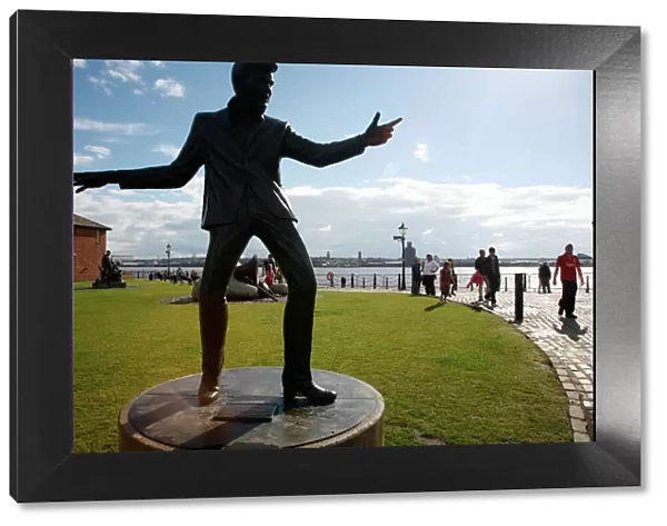 The statue of Billy Fury by Albert Dock and the Mersey River, Liverpool