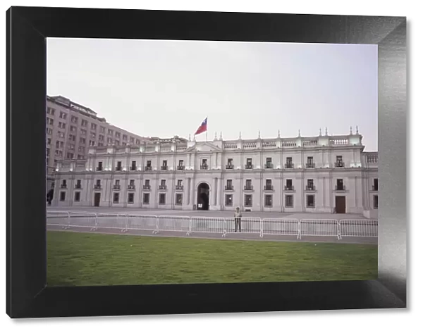 Guard stands in front of La Moneda, the current seat of the President of Chile